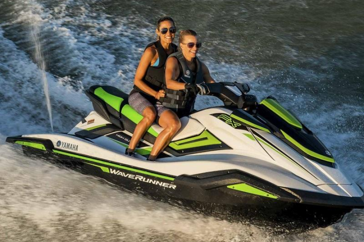 a woman riding a jet ski