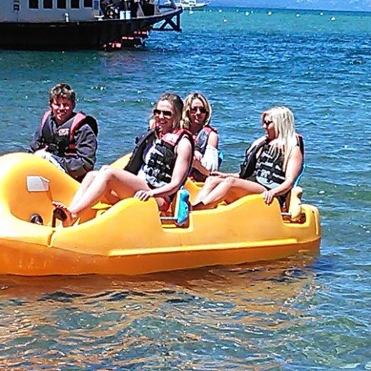 a group of people on a boat in the water