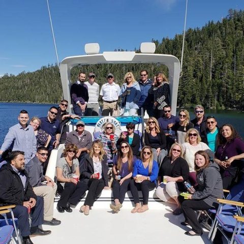 a group of people riding on the back of a boat