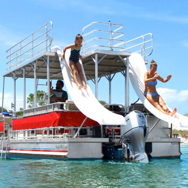 a group of people on a boat in the water